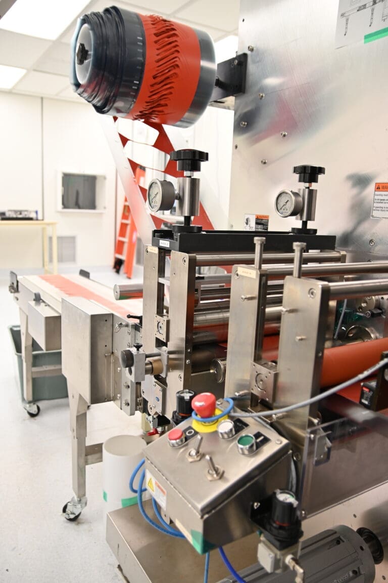 Closeup Photo of Kent Display Contract Roll-to-Part Manufacturing Line
